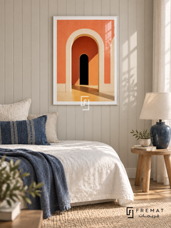 Facade Coral (PLC20) framed architectural wall art with a satin white PVC frame, flat white paper border and glass reflection. Relaxed guest bedroom, pale warm-gray beadboard wall, white linen daybed 160cm.