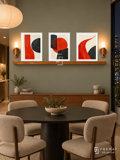 Vermilion Counterpoint shelf set in white frames, three 30 x 40 cm artworks with equal 2 cm borders, 130 cm honey wood shelf and two warm sensor lamps. Sage city dining room at night.