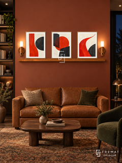 Vermilion Counterpoint shelf set in wooden texture frames, three 30 x 40 cm artworks with equal 2 cm borders, 130 cm honey wood shelf and two warm sensor lamps. Warm library lounge at night.
