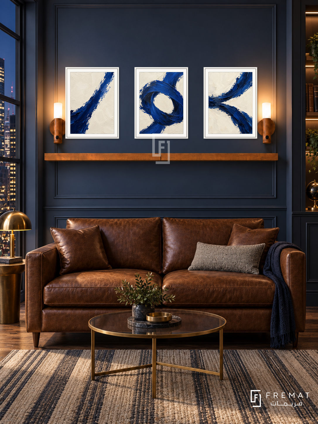 Ultramarine Tension complete shelf set in white frames: three 30 x 40 cm artworks with equal 2 cm borders, honey wood shelf and two sensor lamps. Navy study lounge at night.