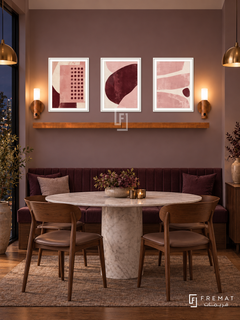 Pink Noise shelf set in white frames, three 30 x 40 cm artworks with 2 cm borders, honey wood shelf and two sensor lamps. Night contemporary mauve dining room.