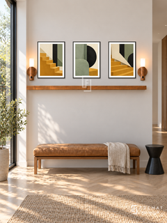 Paper City shelf set in black frames, three 30 x 40 cm artworks with 2 cm borders, honey wood shelf and two sensor lamps. Morning quiet modern hallway.