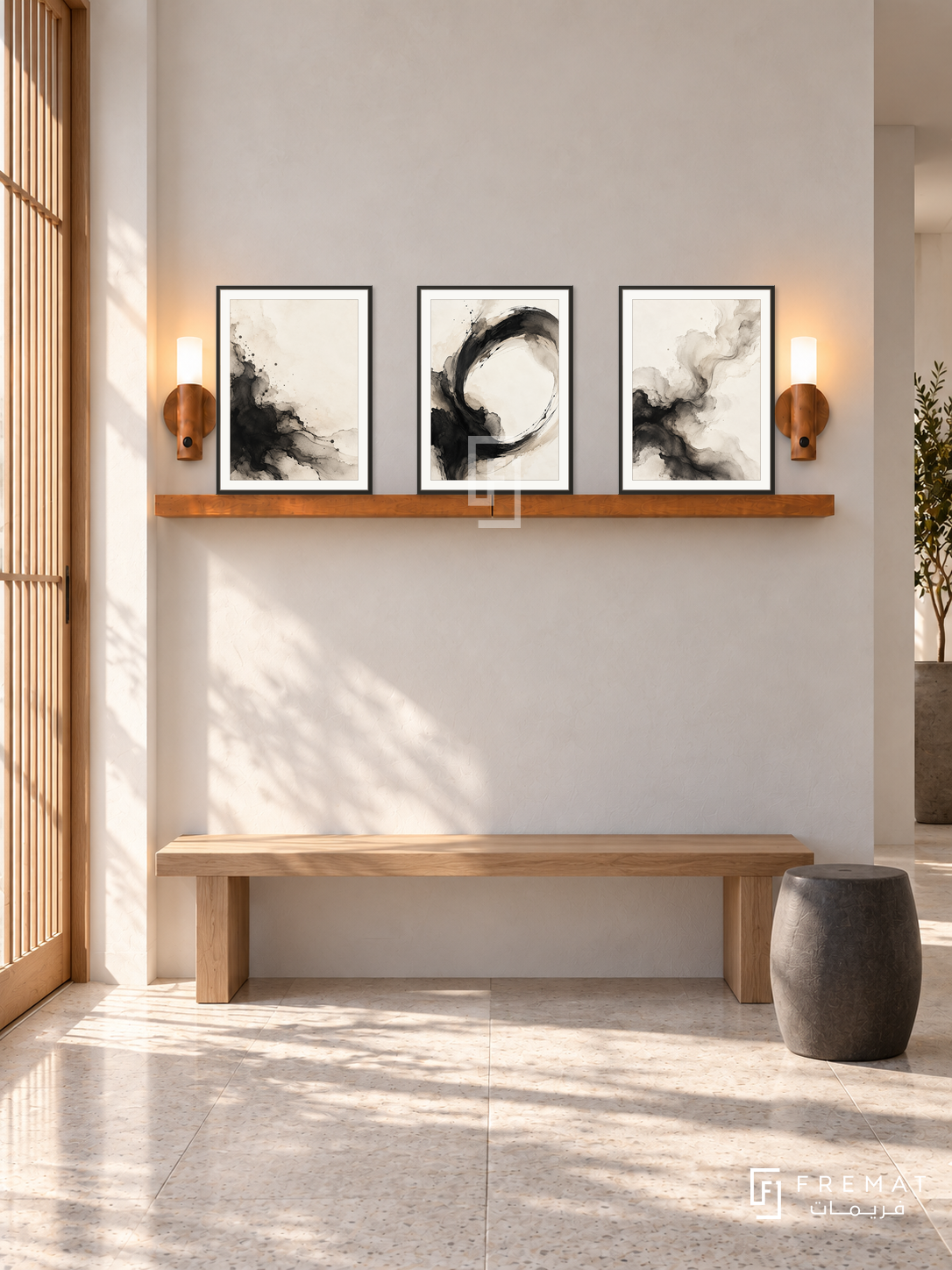 FREMAT SH-ABS20-BLK shelf set with three 30 x 40 cm framed artworks, 2 cm white borders, honey wood shelf and two upward sensor lamps. Morning daylight interior.