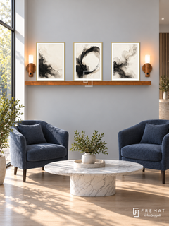 FREMAT SH-ABS20-GLD shelf set with three 30 x 40 cm framed artworks, 2 cm white borders, honey wood shelf and two upward sensor lamps. Morning daylight interior.
