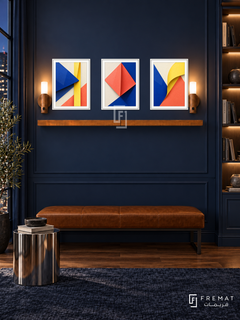FREMAT SH-ABS21-WHT shelf set, three 30 x 40 cm artworks with 2 cm white mats, honey wood shelf and two upward sensor lamps. Night contemporary navy library, navy wall, cognac bench, polished steel stool, walnut floor, illuminated bookshelf right.