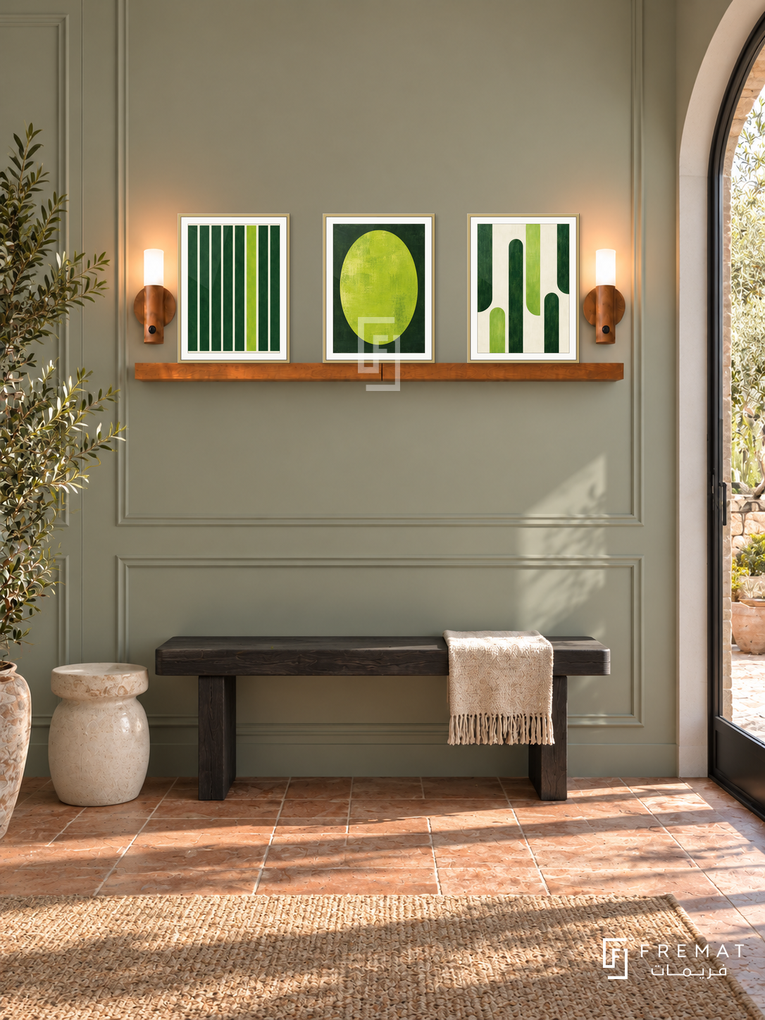 FREMAT SH-ABS24-GLD shelf set, three 30 x 40 cm artworks with 2 cm white mats, honey wood shelf and two upward sensor lamps. Morning contemporary sage corridor, sage panel wall, black wood bench, cream ceramic stool, terracotta floor, arched garden door.