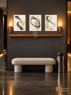 FREMAT SH-ABS29-WOD shelf set, three 30 x 40 cm artworks with 2 cm white mats, honey wood shelf and two upward sensor lamps. Night modern charcoal corridor, graphite wall, cream sculptural bench, chrome pedestal, dark stone floor, amber doorway right.