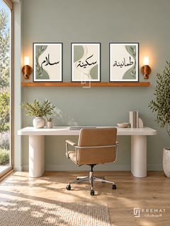FREMAT Sage Ribbon shelf set with three 30 x 40 cm frames, 2 cm white borders, honey wood shelf and two warm sensor lamps. Morning Scandinavian home office, muted sage wall, sculptural white desk positioned BELOW shelf with no overlap, tan swivel chair, wide oak floorboards, garden window left, orderly elegant workspace.