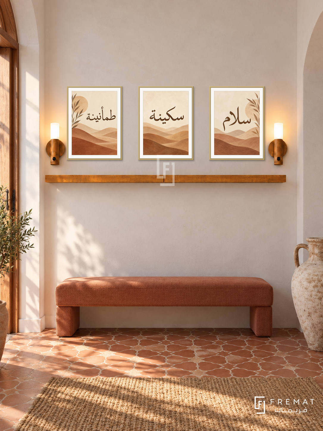 FREMAT Clay Dunes shelf set with three 30 x 40 cm frames, 2 cm white borders, honey wood shelf and two warm sensor lamps. Morning Spanish modern hallway, off-white limewashed wall, terracotta upholstered bench, patterned red clay floor, wood doorway left, large ceramic amphora right.