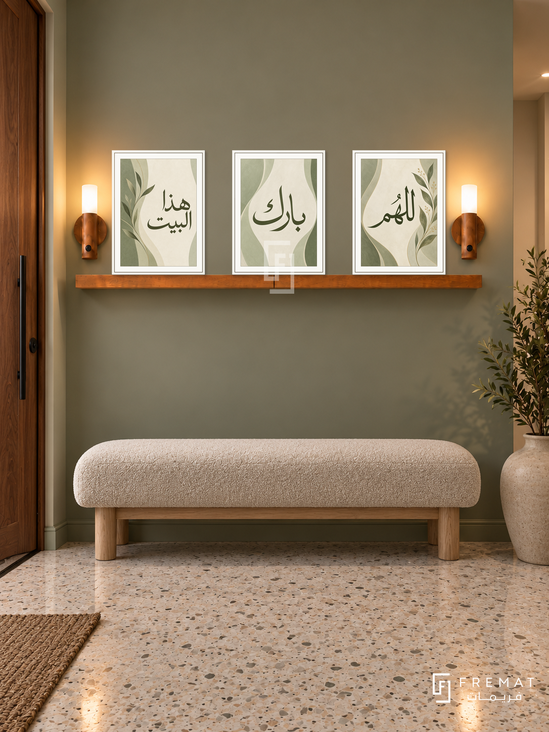 FREMAT Sage Home shelf set with three 30 x 40 cm frames, 2 cm white borders, honey wood shelf and two warm sensor lamps. Night contemporary sage entrance, green-grey wall, oatmeal boucle bench with light wood legs, light terrazzo floor, walnut door left, ceramic floor vessel right.