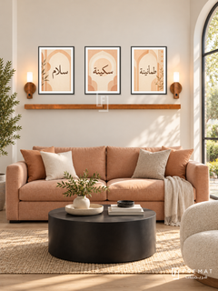 FREMAT Apricot Calm shelf set with three 30 x 40 cm black frames, 2 cm white borders, honey wood shelf and two warm sensor lamps. Morning cheerful contemporary living room, cream wall, apricot linen sofa, black cylindrical coffee table, light oak floor, arched garden window right.