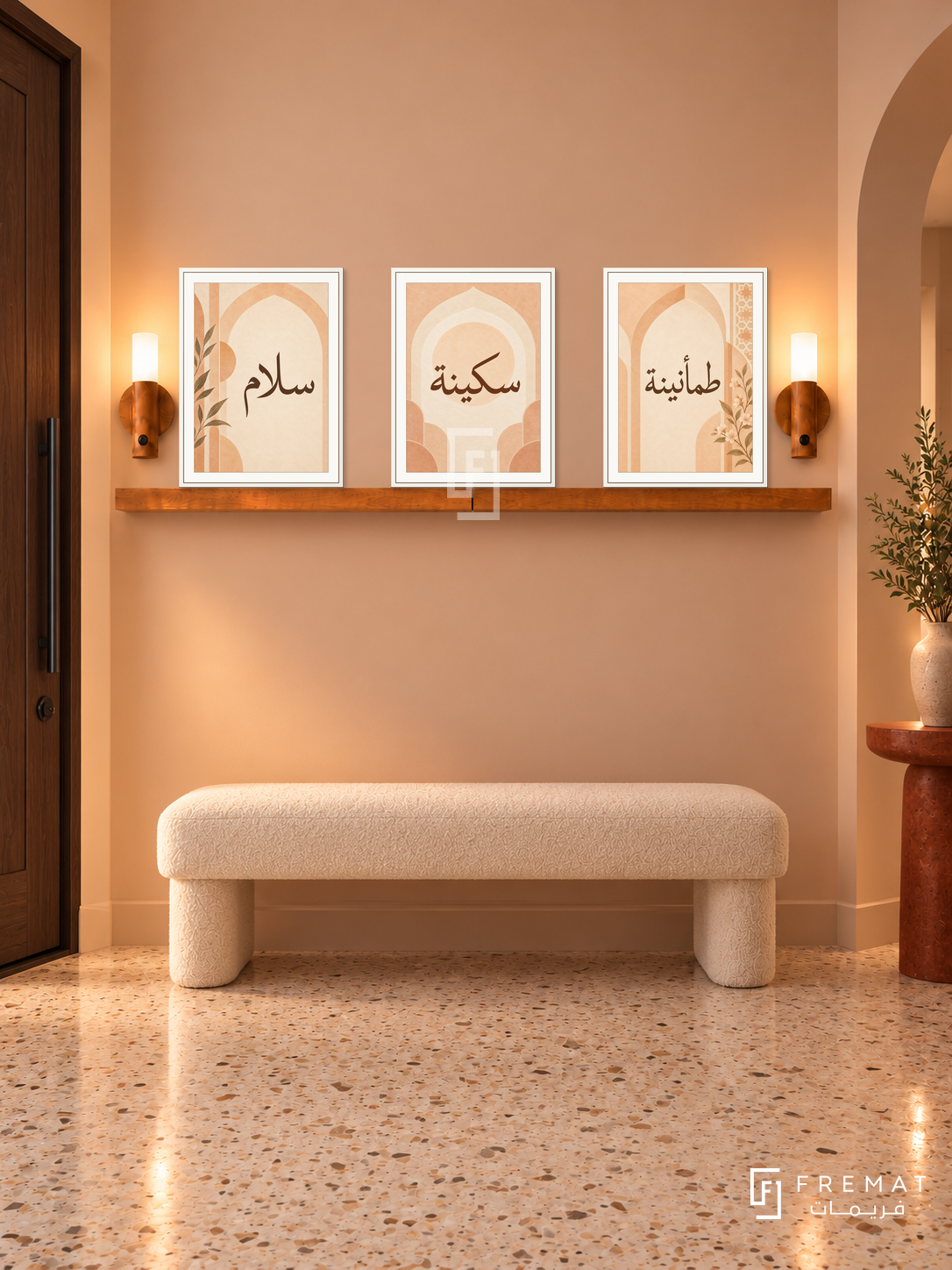 FREMAT Apricot Calm shelf set with three 30 x 40 cm white frames, 2 cm white borders, honey wood shelf and two warm sensor lamps. Night pale peach entrance, warm peach wall, ivory upholstered bench, rust pedestal table, cream terrazzo floor, dark wood door left.