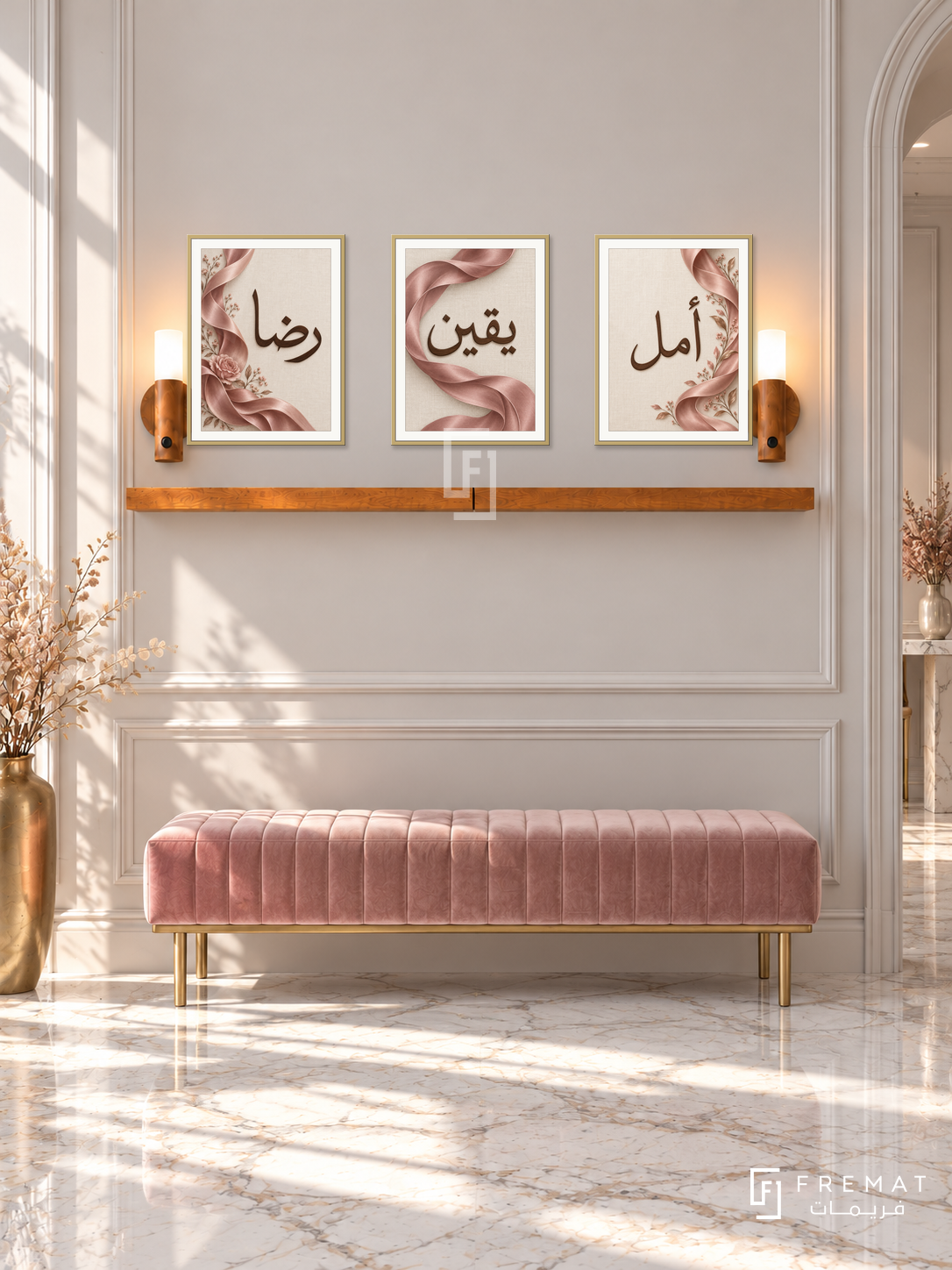 FREMAT Rose Ribbon shelf set with three 30 x 40 cm gold frames, 2 cm white borders, honey wood shelf and two warm sensor lamps. Morning refined rose reception hall with pale warm grey moulded wall, blush velvet bench, white marble floor, brass vase with dried stems at far left.