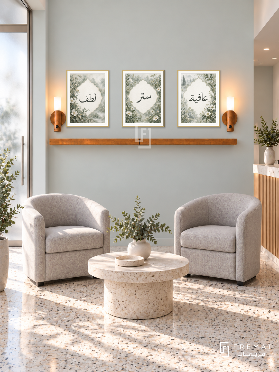 FREMAT Mist Garden shelf set with three 30 x 40 cm gold frames, 2 cm white borders, honey wood shelf and two warm sensor lamps. Morning elegant clinic reception, very pale eucalyptus wall, two dove grey tub chairs, round ivory stone table, terrazzo floor and frosted glass doorway left.