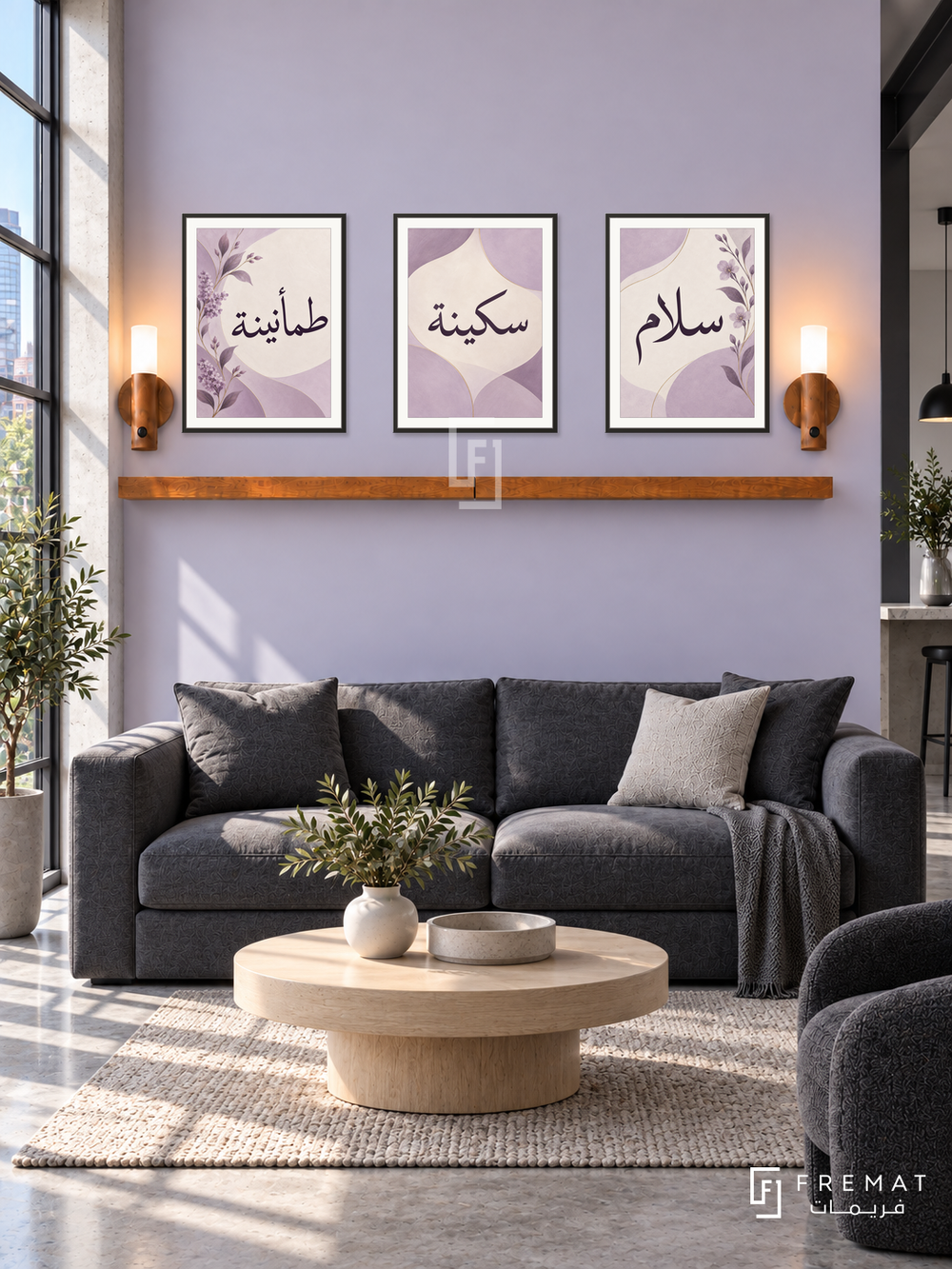 FREMAT Lilac Peace shelf set with three 30 x 40 cm black frames, 2 cm white borders, honey wood shelf and two warm sensor lamps. Morning modern loft lounge, pale lilac wall, charcoal low sofa, rounded pale oak table, concrete floor, industrial window left.