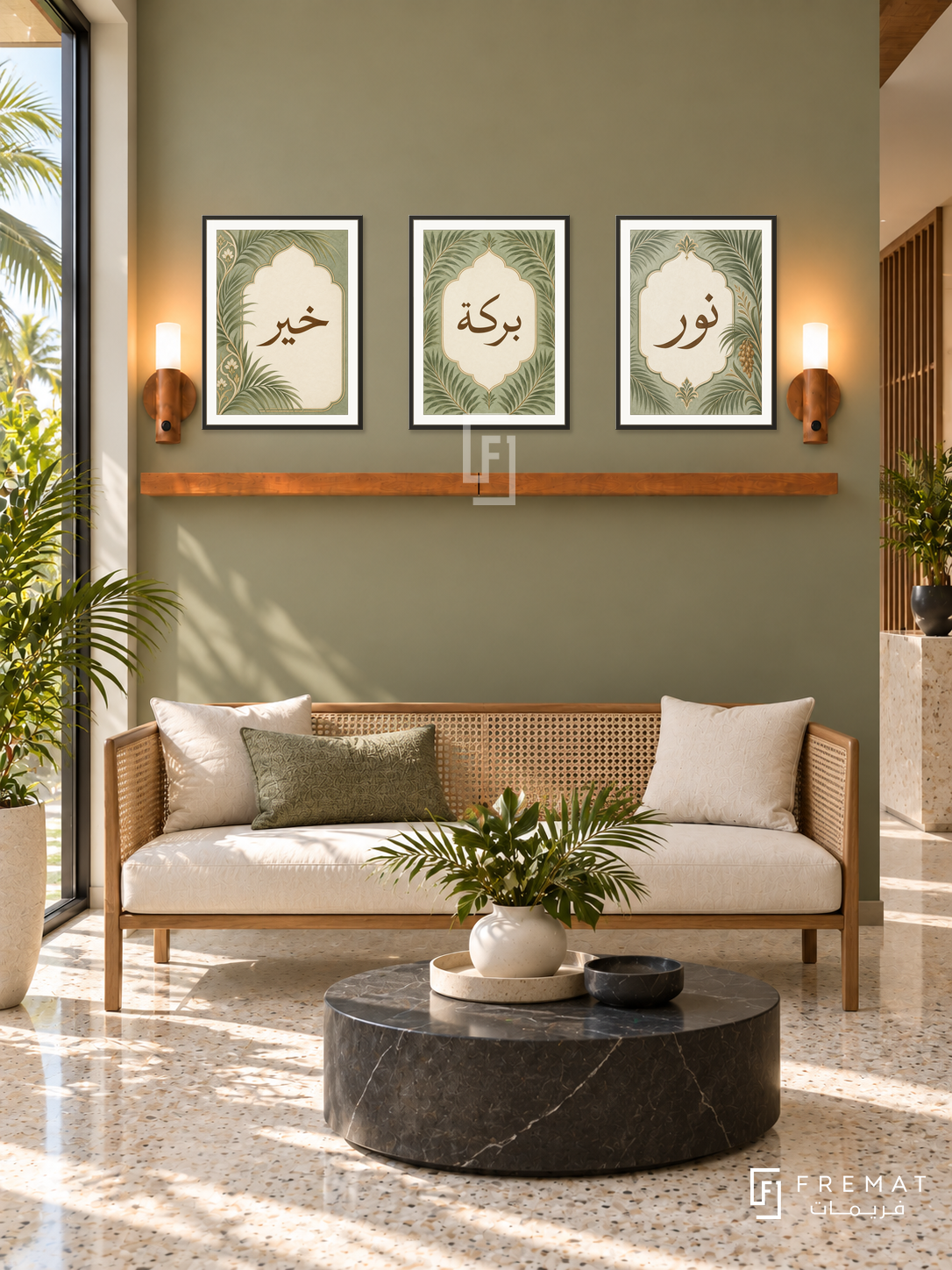 FREMAT Palm Cartouche shelf set with three 30 x 40 cm black frames, 2 cm white borders, honey wood shelf and two warm sensor lamps. Morning tropical modern reception, muted olive wall, cream cane-backed settee, black round stone coffee table, cream terrazzo, palms visible through left window.