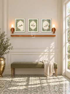FREMAT Palm Cartouche shelf set with three 30 x 40 cm gold frames, 2 cm white borders, honey wood shelf and two warm sensor lamps. Morning classic botanical hallway, creamy panelled wall, olive linen bench, patterned pale green tile floor, bright side window right and brass urn left.