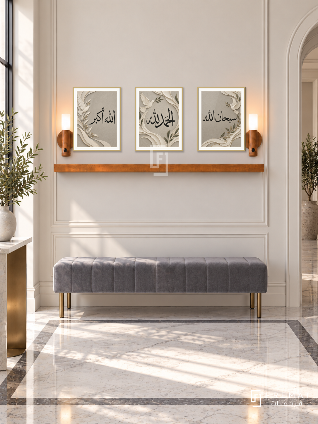 FREMAT Dove Praise shelf set with three 30 x 40 cm gold frames, 2 cm white borders, honey wood shelf and two warm sensor lamps. Morning elegant entrance gallery, ivory moulded wall, grey velvet bench with brass feet, white stone floor with grey inlays, arch doorway right.