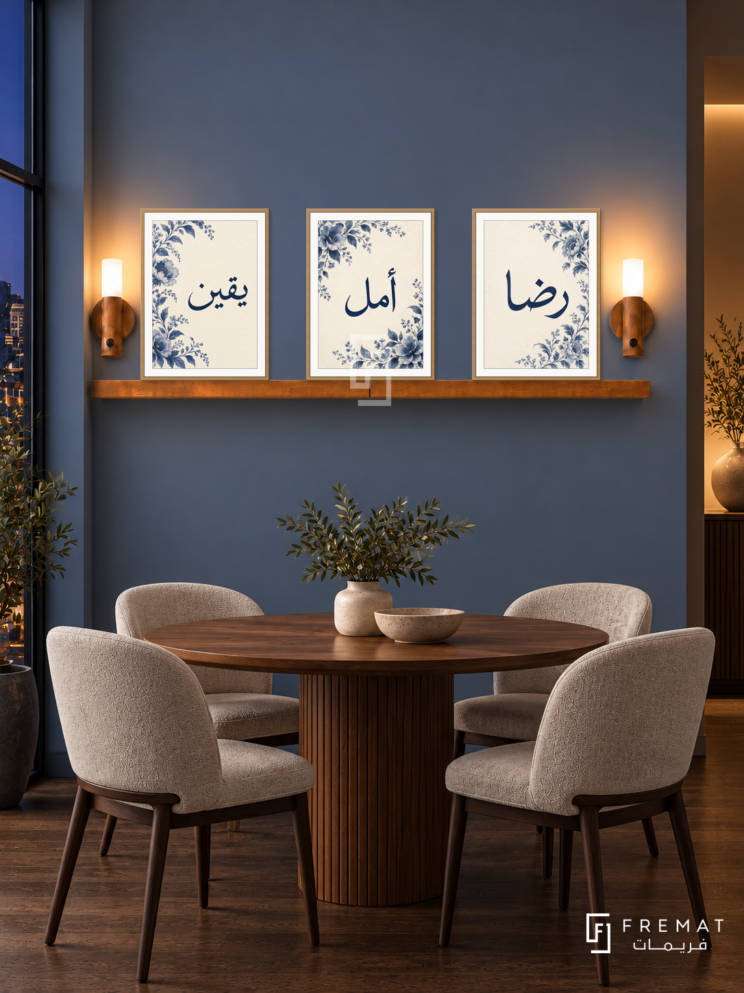 FREMAT Midnight Bloom shelf set with three 30 x 40 cm wooden texture frames, 2 cm white borders, honey wood shelf and two warm sensor lamps. Night modern blue dining nook, slate blue wall, walnut round table, oatmeal chairs, dark oak floor, warm side alcove right.