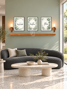 FREMAT Eucalyptus Calm shelf set with three 30 x 40 cm black frames, 2 cm white borders, honey wood shelf and two warm sensor lamps. Morning contemporary garden reception, pale eucalyptus green wall, charcoal curved sofa, oval limestone coffee table, cream terrazzo floor, broad bright garden window right.