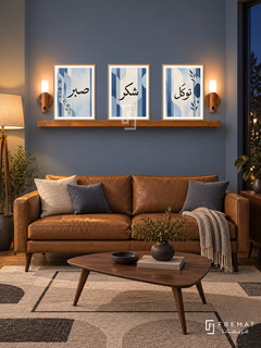 FREMAT Soft Cobalt shelf set with three 30 x 40 cm wooden texture frames, 2 cm white borders, honey wood shelf and two warm sensor lamps. Night mid-century blue sitting room, muted steel blue wall, caramel leather sofa, walnut triangular coffee table, geometric cream rug, dark window right and warm floor lamp far left.