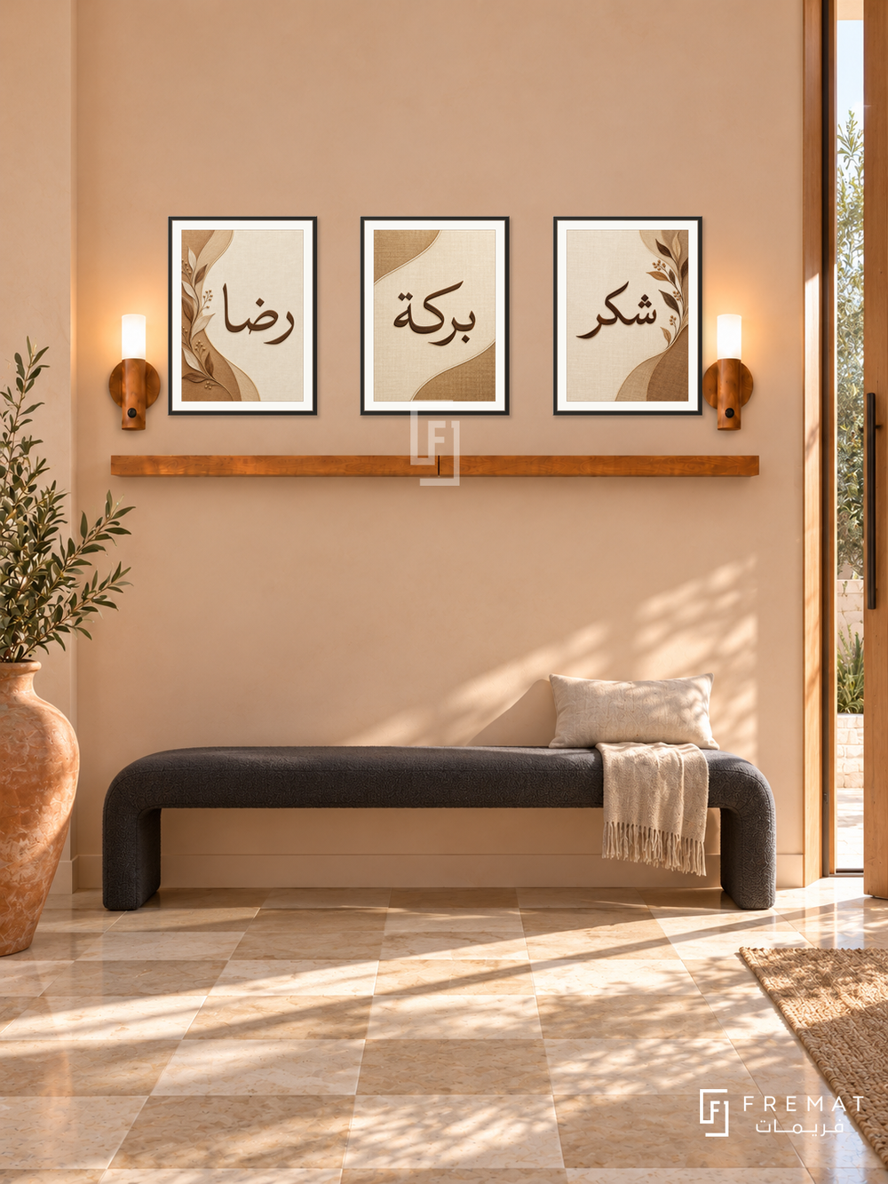 FREMAT Warm Gratitude shelf set with three 30 x 40 cm black frames, 2 cm white borders, honey wood shelf and two warm sensor lamps. Morning warm contemporary foyer with pale peach plaster wall, long charcoal upholstered bench with curved black legs, oversized terracotta floor vase far left, cream checkerboard limestone floor and sunny pivot door right.