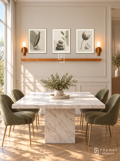FREMAT Seed And Stone shelf set with three 30 x 40 cm gold frames, 2 cm white borders, honey wood shelf and two warm sensor lamps. Morning elegant cream dining room, sand panelled wall, square white marble table, muted olive upholstered chairs on brass legs, parquet flooring, sunny window left.