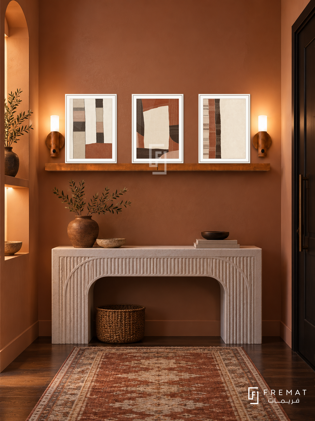 FREMAT Desert Textiles shelf set with three 30 x 40 cm white frames, 2 cm white borders, honey wood shelf and two warm sensor lamps. Night contemporary terracotta corridor, dusty clay wall, white carved console, rust and cream runner, dark wood floor, dark entry door right, lit niche left.