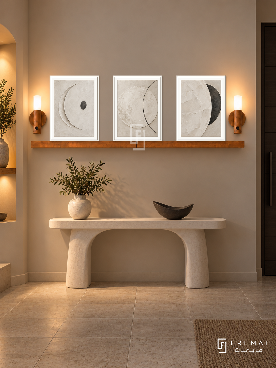 FREMAT Moon Clay shelf set with three 30 x 40 cm white frames, 2 cm white borders, honey wood shelf and two warm sensor lamps. Night soft neutral foyer, warm putty wall, ivory sculptural console with a dark moon-shaped ceramic bowl, pale stone tiles, dark door right, warm niche left.