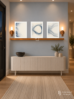 FREMAT Woven Water shelf set with three 30 x 40 cm white frames, 2 cm white borders, honey wood shelf and two warm sensor lamps. Night Scandinavian hallway, pale blue-grey wall, white fluted console, dark ceramic bowl, natural oak floor and cream striped runner, dark doorway left, warm ceiling spots.