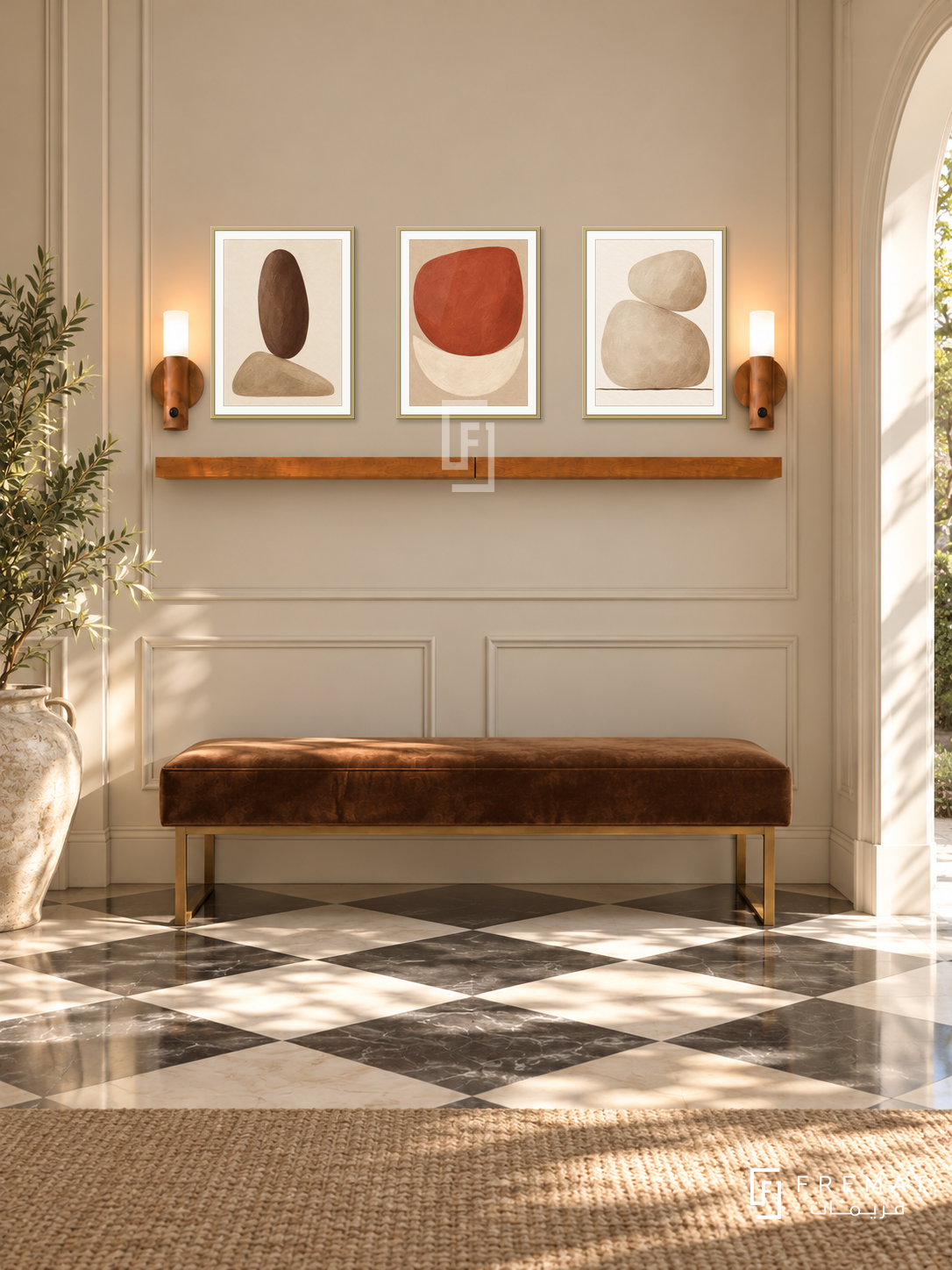 FREMAT Earthen Balance shelf set with three 30 x 40 cm gold frames, 2 cm white borders, honey wood shelf and two warm sensor lamps. Morning transitional foyer, sand coloured panelled wall, tobacco velvet bench on brass feet, black and cream checker floor, sunlit arched doorway right, large ceramic urn left.