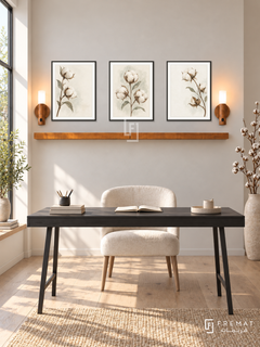 FREMAT Wild Cotton shelf set with three 30 x 40 cm black frames, 2 cm white borders, honey wood shelf and two warm sensor lamps. Morning airy Scandinavian study, pale linen wall, black writing desk and ivory upholstered chair, pale oak planks, sunlit narrow window left, sculptural dry cotton branches far right.