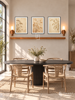 FREMAT Dried Meadow shelf set with three 30 x 40 cm black frames, 2 cm white borders, honey wood shelf and two warm sensor lamps. Morning farmhouse-modern dining corner, pale wheat plaster wall, black oval dining table and light woven chairs, cream stone floor, sunny French door left, dried meadow flowers at far right.