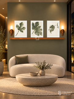 FREMAT Fig Leaf Poetry shelf set with three 30 x 40 cm white frames, 2 cm white borders, honey wood shelf and two warm sensor lamps. Night sophisticated organic reception, muted fig green wall, white curved loveseat, oval pale stone table, cream rug, dark glass doors right, warm ceiling spots.