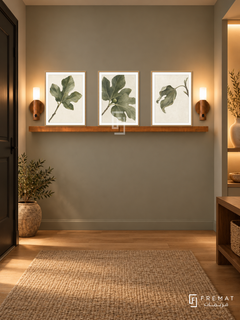 FREMAT Fig Leaf Poetry shelf set with three 30 x 40 cm wooden texture frames, 2 cm white borders, honey wood shelf and two warm sensor lamps. Night warm minimalist entry, sage grey wall, walnut console with open shelf, cream sculptural vase, oak floor and flax runner, dark door left, illuminated niche right.