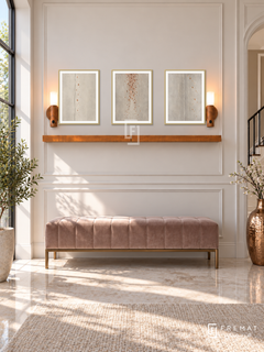 FREMAT Copper Rain shelf set with three 30 x 40 cm gold frames, 2 cm white borders, honey wood shelf and two warm sensor lamps. Morning glamorous transitional hall, pearl moulded wall, rose taupe velvet bench with warm metal legs, pale marble floor, sunny tall window left, copper vessel right.