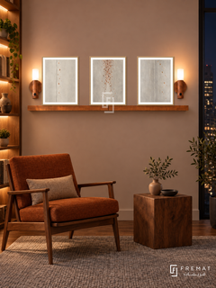 FREMAT Copper Rain shelf set with three 30 x 40 cm wooden texture frames, 2 cm white borders, honey wood shelf and two warm sensor lamps. Night midcentury reading room, warm mauve beige wall, walnut lounge chair with rust upholstery, wooden cube side table, grey wool rug, dark city window right, lit oak bookcase left.