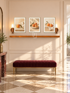 FREMAT Sunlit Apricot shelf set with three 30 x 40 cm gold frames, 2 cm white borders, honey wood shelf and two warm sensor lamps. Morning Art Deco apartment foyer, peach ivory wall with slim mouldings, burgundy velvet bench and brass legs, checkerboard cream stone floor, bright doorway right.