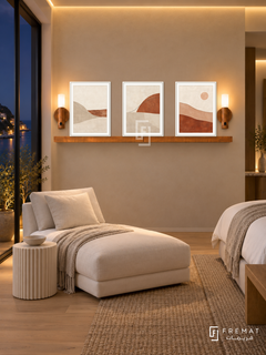 FREMAT Horizon Stitch shelf set with three 30 x 40 cm white frames, 2 cm white borders, honey wood shelf and two warm sensor lamps. Night contemporary seaside bedroom lounge, sand wall, white linen chaise and ribbed cream side table, light oak floor, dark sea-view doors left, subtle warm ceiling cove.