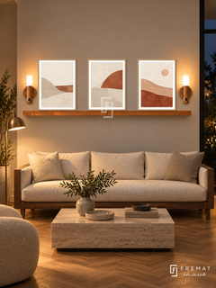 FREMAT Horizon Stitch shelf set with three 30 x 40 cm wooden texture frames, 2 cm white borders, honey wood shelf and two warm sensor lamps. Night organic townhouse sitting room, warm greige wall, walnut sofa with cream cushions, low rectangular stone table, herringbone oak floor, dark window right, amber reading lamp far left.
