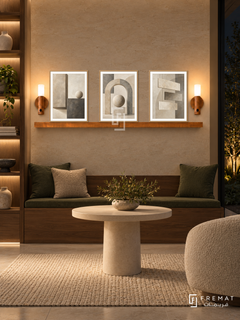 FREMAT Balanced Structure shelf set with three 30 x 40 cm wooden texture frames, 2 cm white borders, honey wood shelf and two warm sensor lamps. Night contemporary office quiet nook, warm stone display wall, walnut built-in bench with dark green cushions, round cream pedestal table, wool rug, dark garden right, illuminated storage niches left.