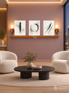 FREMAT Quiet Focus shelf set with three 30 x 40 cm white frames, 2 cm white borders, honey wood shelf and two warm sensor lamps. Night design agency breakout room, dusty mauve display wall, white sculptural lounge chairs, black oval coffee table, pale oak floor, skyline glass right, warm ceiling perimeter lighting.