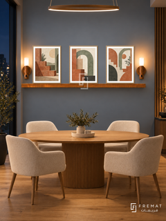 FREMAT Terrace Rhythm shelf set with three 30 x 40 cm wooden texture frames, 2 cm white borders, honey wood shelf and two warm sensor lamps. Night modern agency brainstorming nook, blue grey display wall, four cream upholstered chairs around oval oak meeting table below shelf, dark window left, warm linear pendant high above camera view, oak floor.