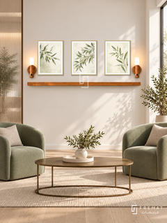 FREMAT Morning Leaves shelf set with three 30 x 40 cm gold frames, 2 cm white borders, honey wood shelf and two warm sensor lamps. Morning refined nutrition clinic lounge, ivory display wall, sage upholstered chairs, thin bronze oval table, pale oak floor, sunlight from right window, ribbed glass divider left.