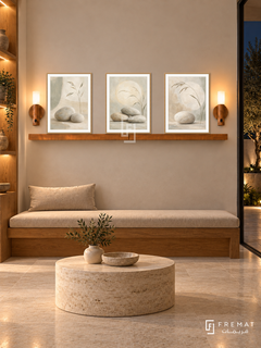 FREMAT Sand And Stone shelf set with three 30 x 40 cm wooden texture frames, 2 cm white borders, honey wood shelf and two warm sensor lamps. Night organic therapy waiting area, pale clay display wall, solid oak bench with beige linen cushion, low cylindrical travertine table, pale stone floor, dark courtyard right, lit wood niches left.