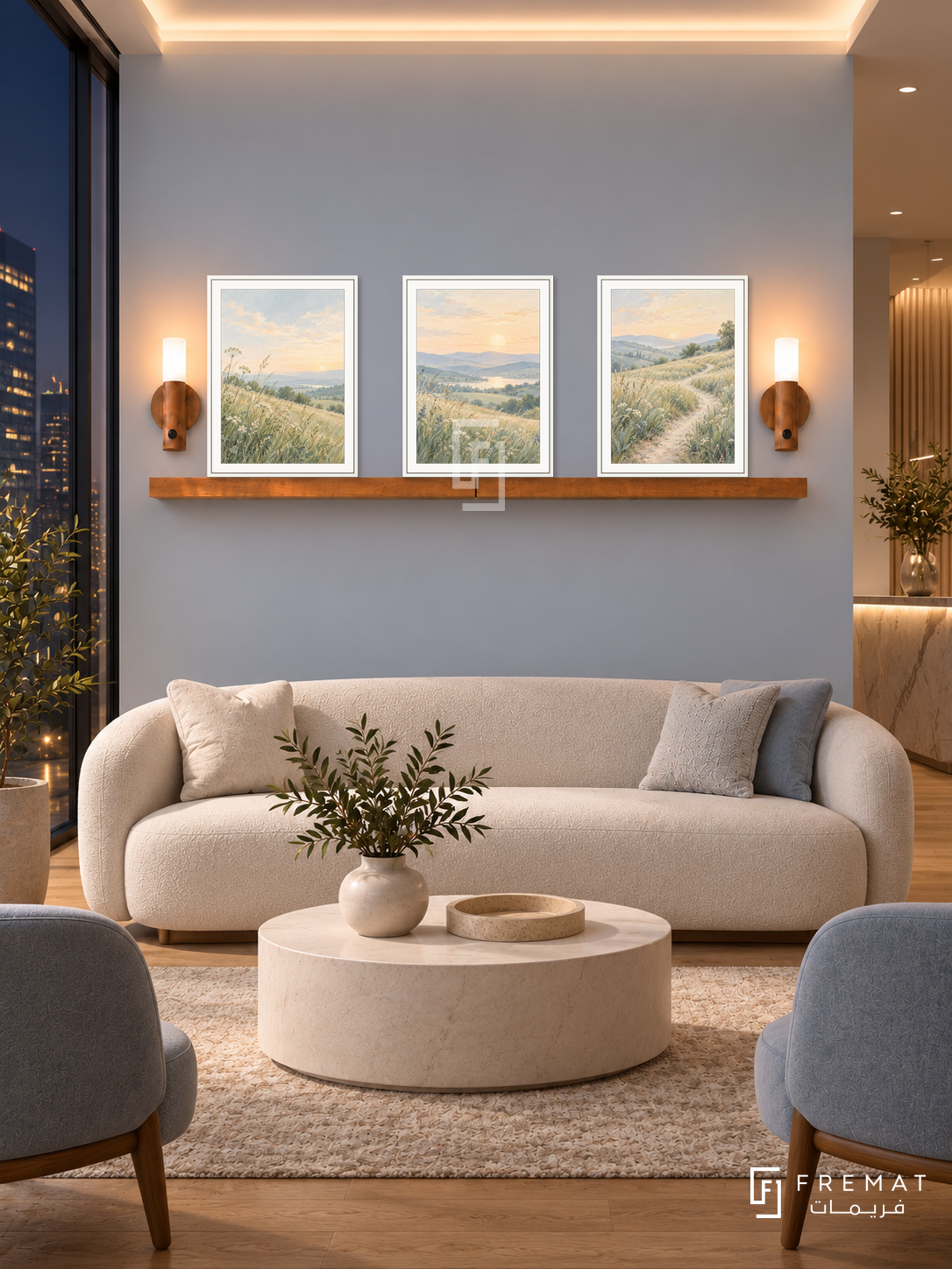 FREMAT New Light shelf set with three 30 x 40 cm white frames, 2 cm white borders, honey wood shelf and two warm sensor lamps. Night elegant wellness clinic waiting lounge, pale blue grey display wall, cream low sofa, ivory drum table, oak floor, dark skyline window left, soft warm ceiling cove.