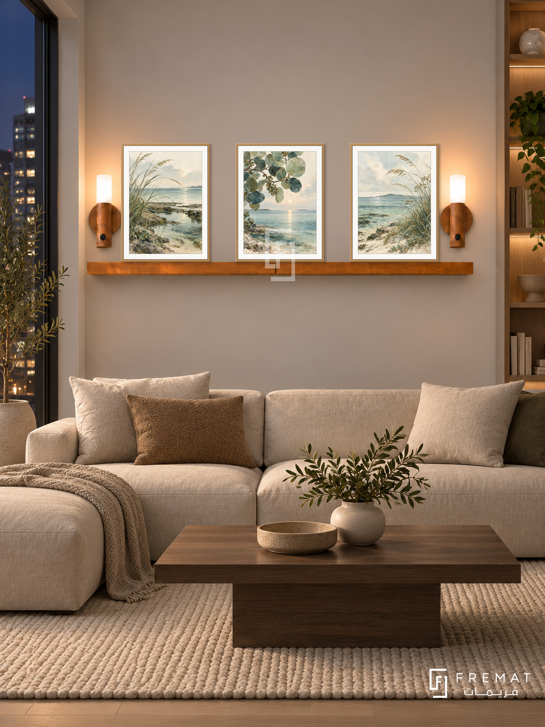 FREMAT Tidal Botanicals shelf set with three 30 x 40 cm wooden texture frames, 2 cm white borders, honey wood shelf and two warm sensor lamps. Night Scandinavian apartment lounge, warm pale grey wall, low linen sectional, rectangular smoked oak table, wool rug, city window left and open bookcase right.