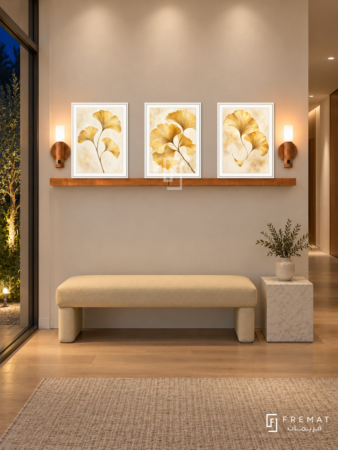 FREMAT Ginkgo Gold shelf set with three 30 x 40 cm white frames, 2 cm white borders, honey wood shelf and two warm sensor lamps. Night minimalist townhouse corridor, ivory plaster, pale yellow upholstered bench, white stone cube table, oak floor, garden glazing left, soft ceiling wash.