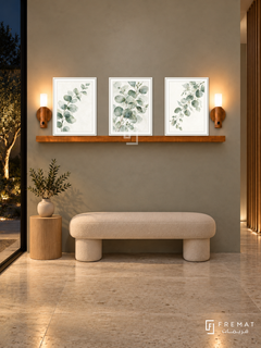 FREMAT Eucalyptus Air shelf set with three 30 x 40 cm white frames, 2 cm white borders, honey wood shelf and two warm sensor lamps. Night modern entrance hall, silver sage plaster, ivory rounded bench, pale oak side cylinder, limestone floor, dark courtyard left, vertical wooden screen right.