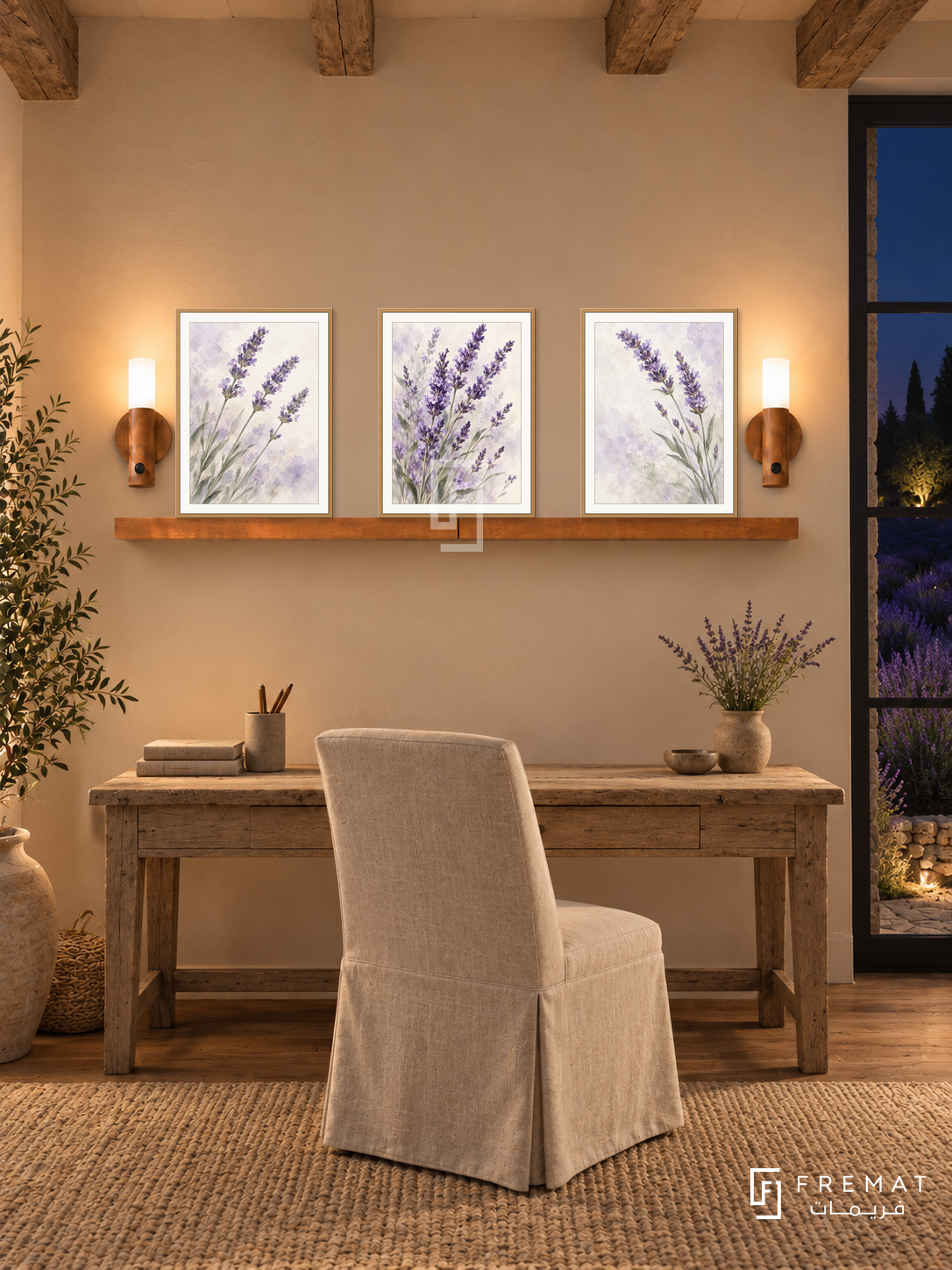 FREMAT Lavender Field shelf set with three 30 x 40 cm wooden texture frames, 2 cm white borders, honey wood shelf and two warm sensor lamps. Night country reading room, warm beige wall, weathered oak writing desk below shelf, linen chair, woven wool rug, dark lavender field outside right, exposed old ceiling beams.